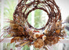 Autumn dried flower wreath with wicker hoop with natural coloured flowers