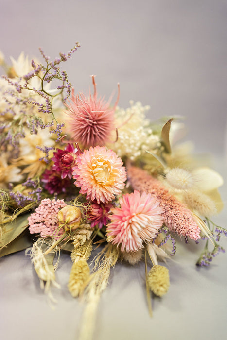 Pink dried helichrysum and thistle flowers