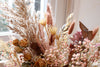 dried flowers bouquet in dusty pink and muted tones.