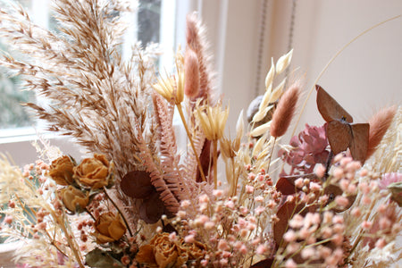dried flowers bouquet in dusty pink and muted tones.