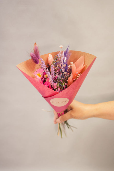 Small bunches of dried flowers in purple and pink shades